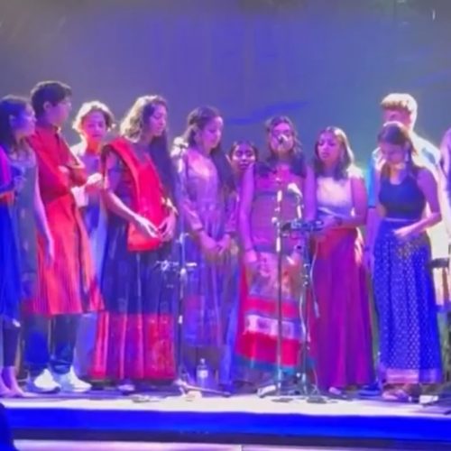 HUM A Cappella performing on stage